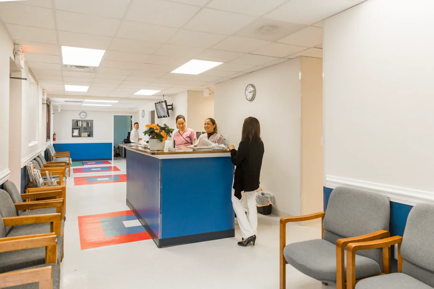 Front desk team taking a call at AAA Pediatrics
