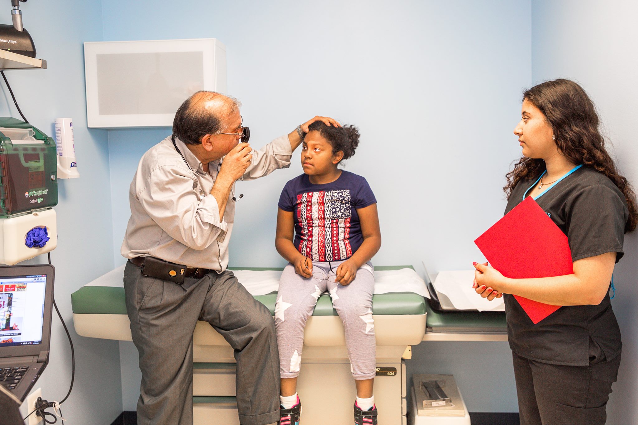 Dr. Sugastti providing caring pediatric examination